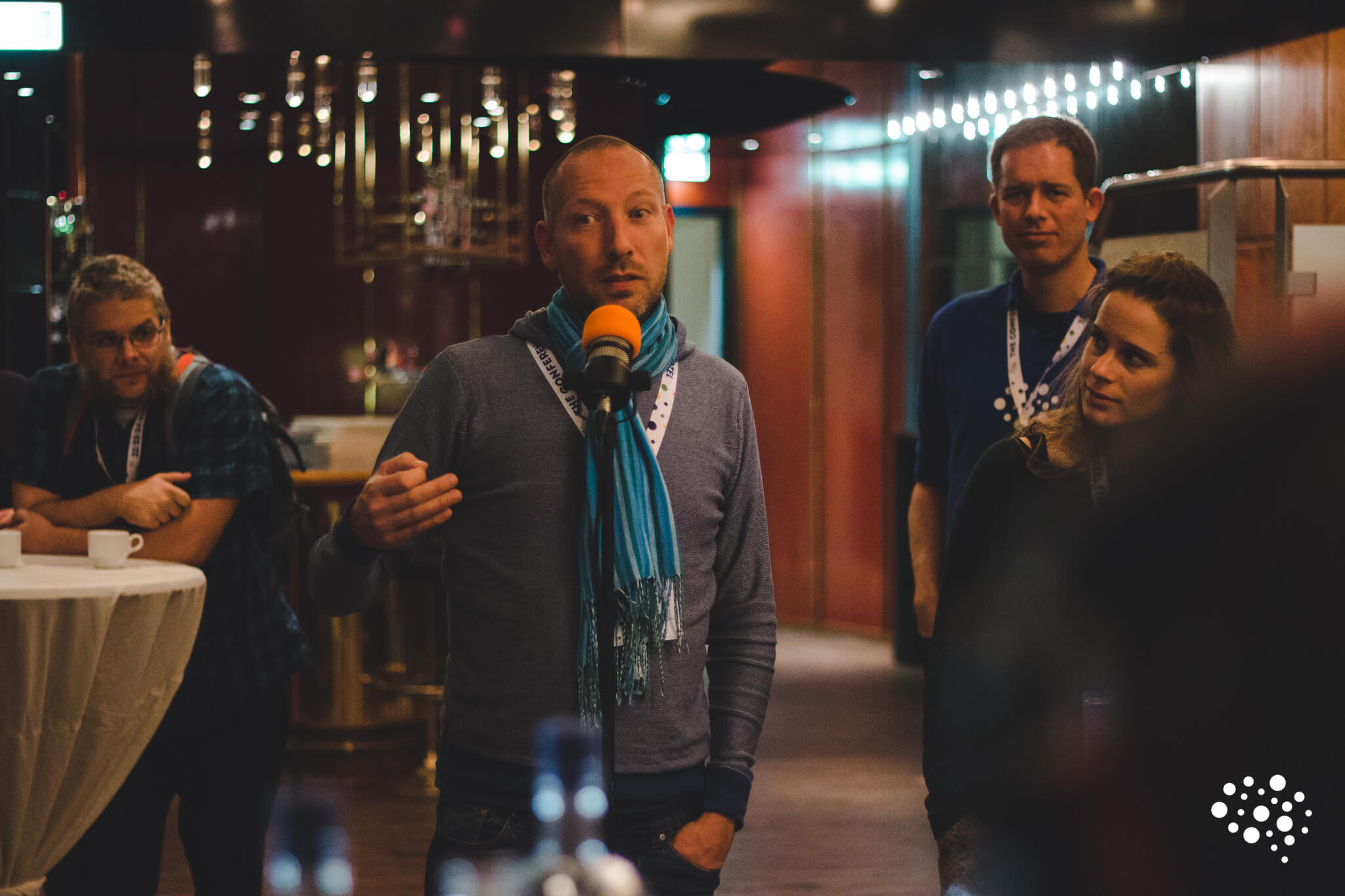 Live podcast recording with packed audience